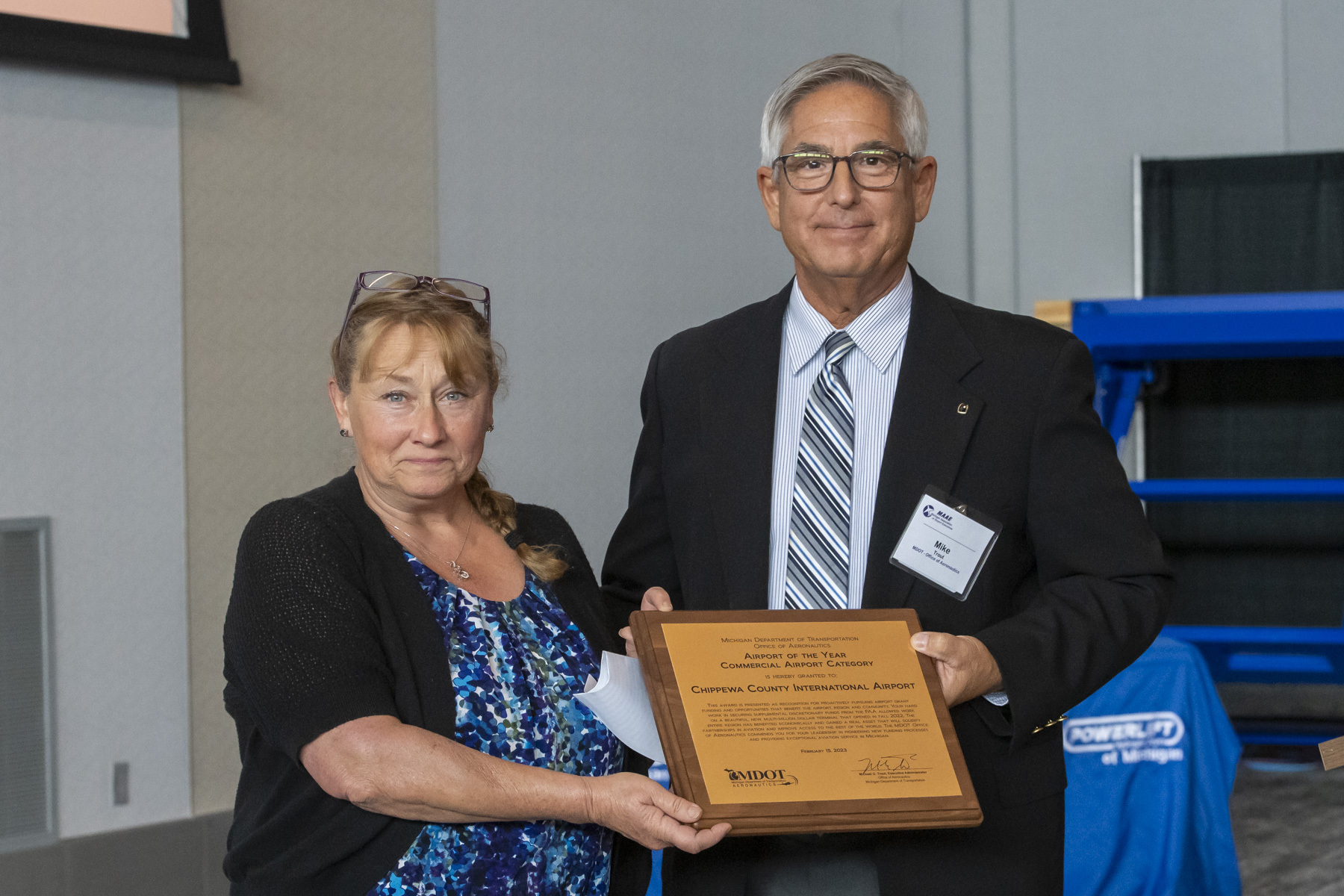 Tami Beseau (left) of the Chippewa County International Airport receives the Commercial Airport of the Year Award 