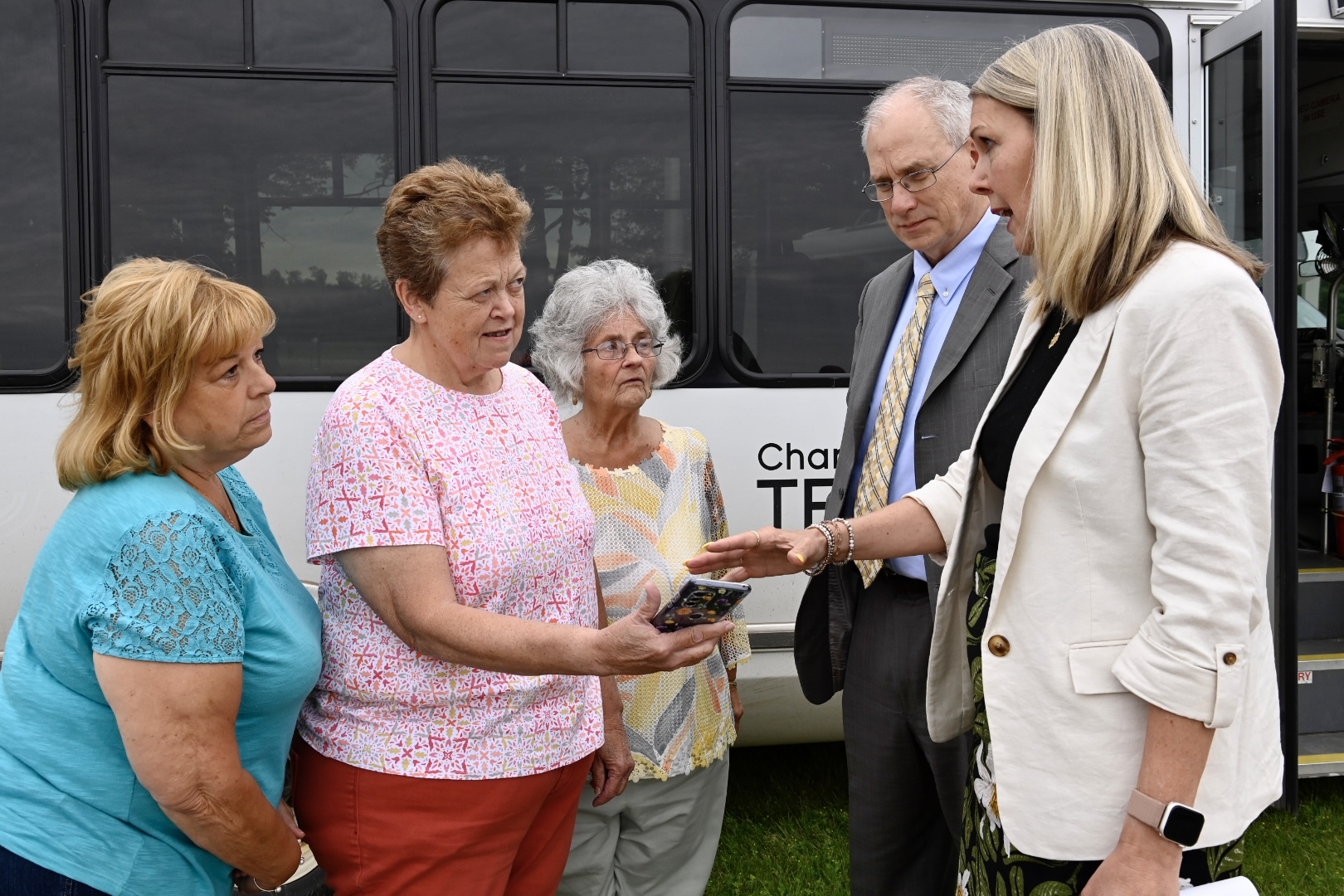 MDOT and USDOT officials meet with transit riders at media event. 