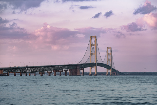 Mackinac Bridge with a purple sky.