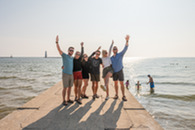 A group of friends on a lighthouse pier in Traverse City