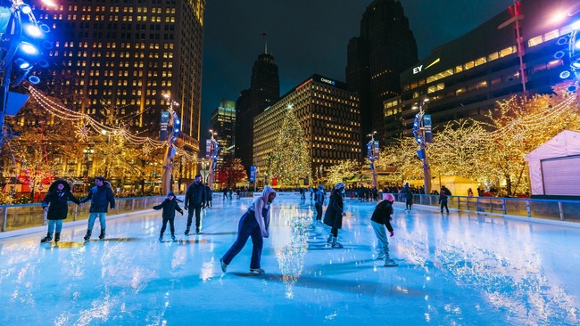 People skating on an outdoor ice rink in Downtown Detroit. 