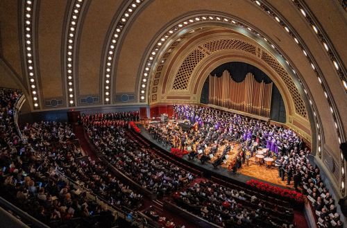 A holiday-themed live orchestra concert in a theatre. 
