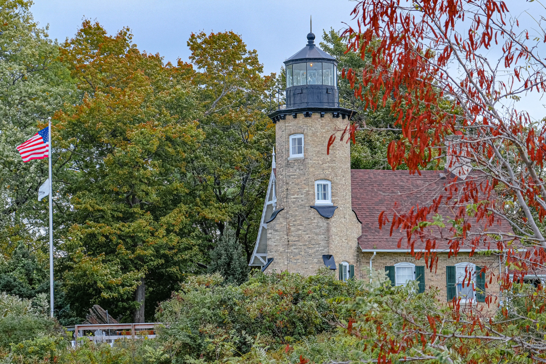 brick lighthouse within trees