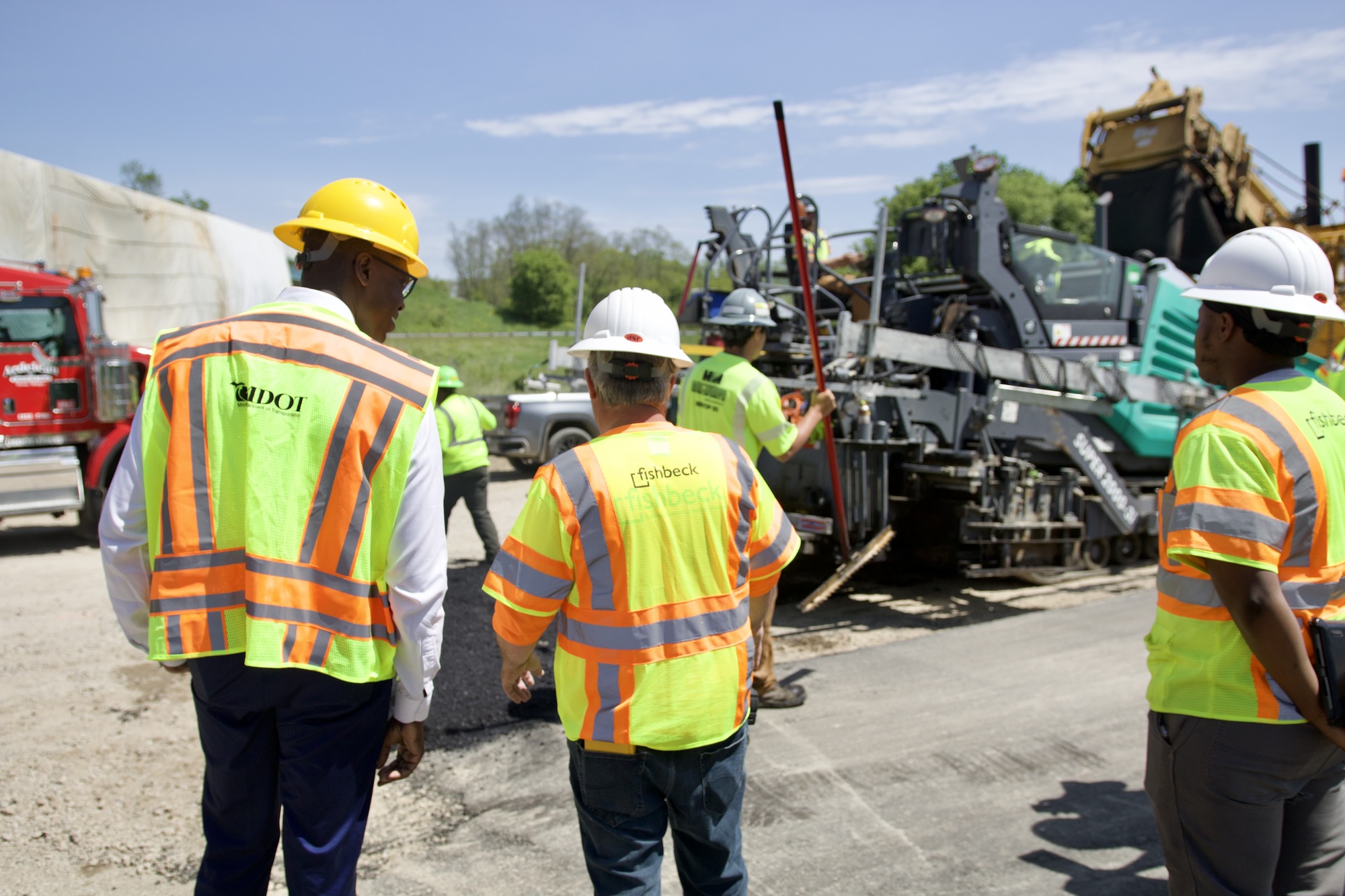 Lt. Governor talks to road crew during visit to view road repairs 