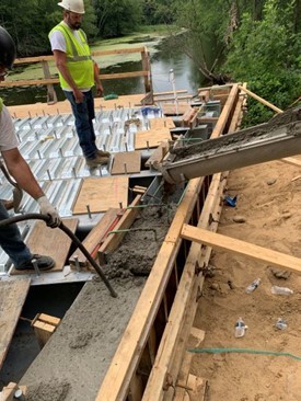 Workers rebuilding the Tallman Road Bridge.