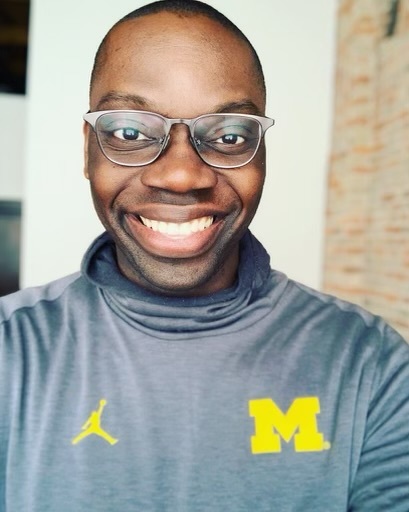 Lieutenant Governor Gilchrist wearing Michigan gear