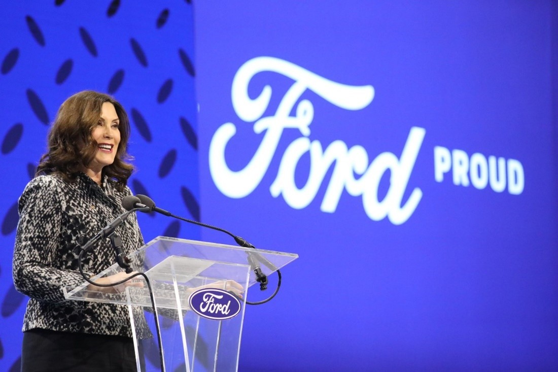 Governor Whitmer makes announcement in front of Ford sign