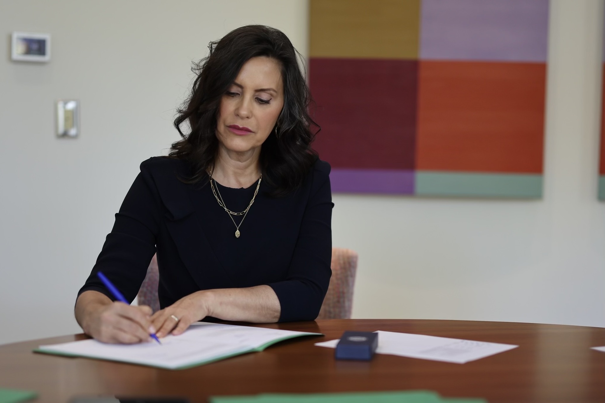 Gov. Whitmer signing a bill