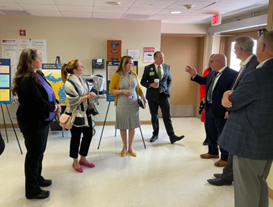Representative Rheingans visiting with the University of Michigan Survival Flight group.