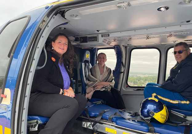 Representatives Rheingans and Byrne pictured in a University of Michigan Health System helicopter.