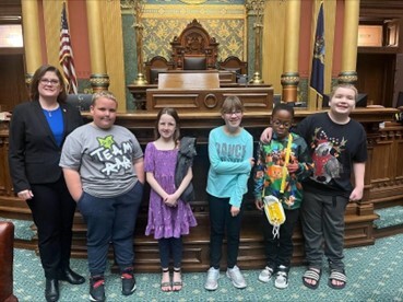 Rep. Hope pictured with students from Holt on the Michigan House floor.