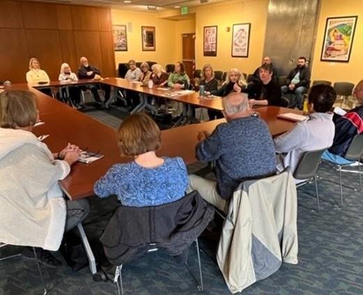 Rep. Coffia speaks with constituents at a coffee hour