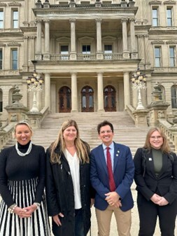 Rep. Morgan pictured with group in front of the Michigan State Capitol.