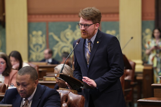 State Rep. Joey Andrews (D-St. Joseph) speaks in favor of funding to restart the Palisades Nuclear Power Plant on the House floor at the state Capitol in Lansing.