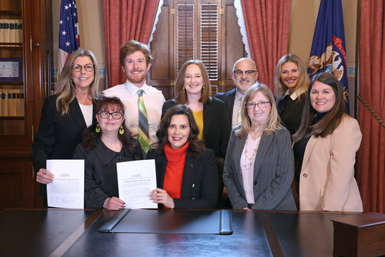 Members of the Hayes family joined Rep. Sharon MacDonell (D-Troy) and Gov. Gretchen Whitmer for the signing of House Bills 4320 and 4378, known as Justice for Allie, at the state Capitol in Lansing. Pictured are, from left, back row: Allie's mother, Dawn Hayes; her brother, Patrick Kellogg; her sister-in-law, Muriel Kellogg; her father, Mark Hayes; her sister, Hannah Hayes. In the front row, from left, are Allie Hayes, Whitmer, MacDonell and Kelly Jones, MacDonell's staffer.
