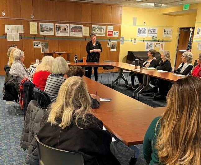 State Rep. Betsy Coffia speaks with constituents at a recent coffee hour.