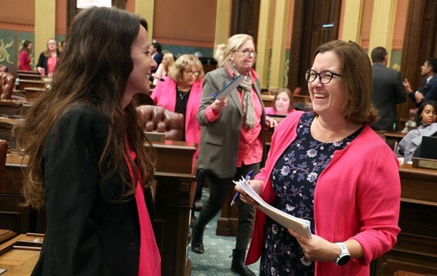 Rep. Price speaks with Rep. Morse on the Michigan House floor