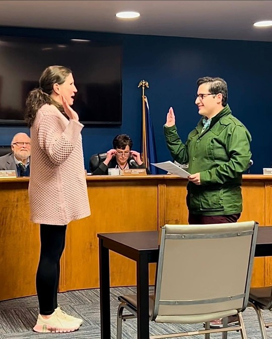 A photo of Rep. Arbit swearing in a new Orchard Lake City Council member.