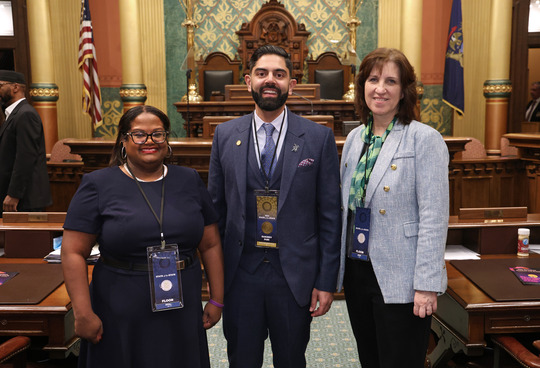 Rep. Puri stands with Sommer Foster and Anne Marie Graham-Hudak on the Michigan House Floor.