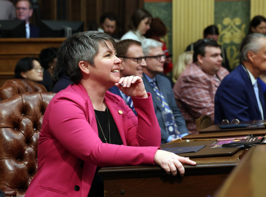 A photo of Rep. Coffia listening to the State of the State address on the floor of the House
