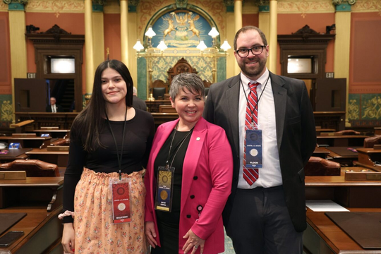 A photo of Rep. Coffia and her guests for the State of the State address