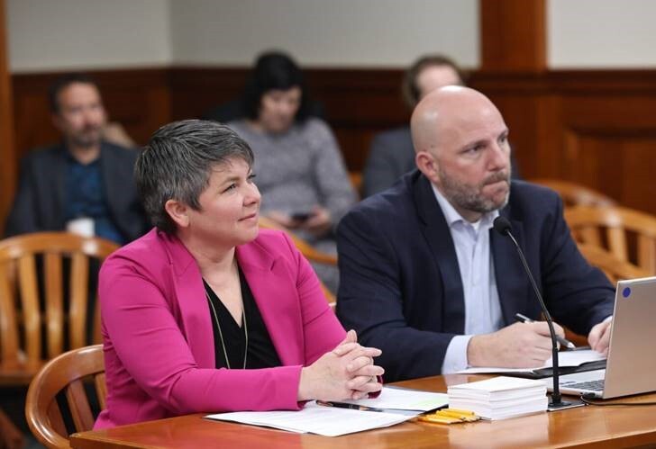 A photo of Rep. Coffia testifying in committee in support of her housing legislation.