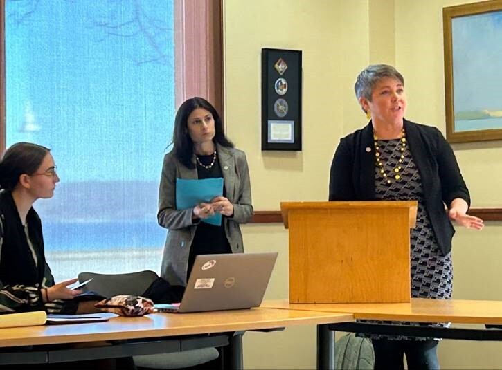 A photo of Rep. Coffia and Attorney General Dana Nessel at an event about business scams.