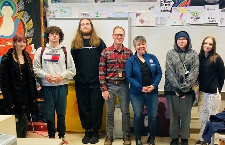 A photo of Rep. Coffia, teacher Joshua Veith and students at Traverse City High School.