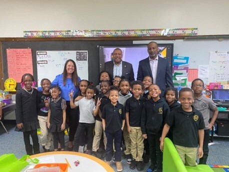 Rep. T. Carter with elementary school children for March National Reading Month.