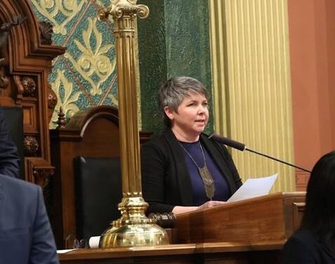 A photo of state Rep. Betsy Coffia delivering the invocation before House session.