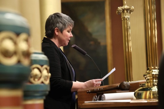 A photo of state Rep. Betsy Coffia delivering the invocation before House session.