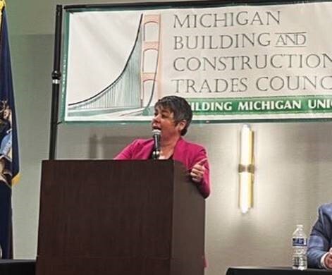 A photo of state Rep. Betsy Coffia speaking at the Building and Construction Trades Council Conference.