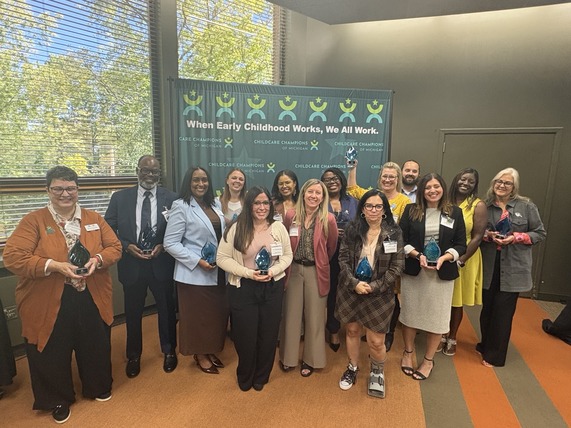 Winners hold their awards at the 2026 Child Care Champions ceremony in East Lansing