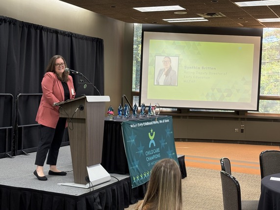 Synthia Britton, acting Deputy Director of OEE, speaks at the 2026 Child Care Champion ceremony