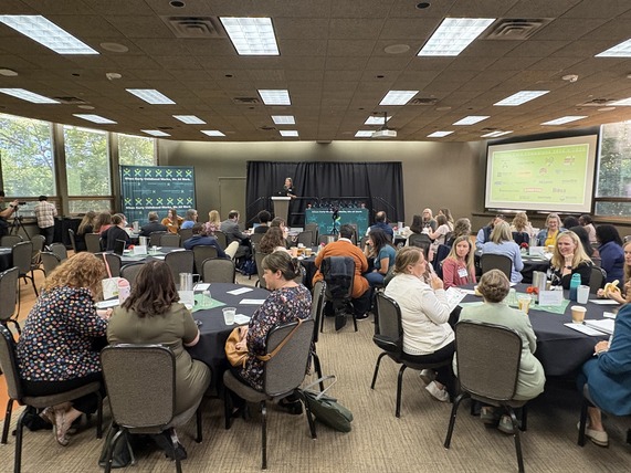 Attendees of the 2026 Child Care Champions ceremony listen as a presenter speaks