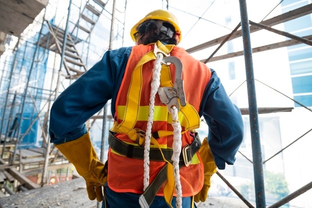 Back view of man with fall protection harness