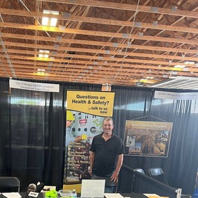 MIOSHA booth at AgroExpo, featuring employee David Magno