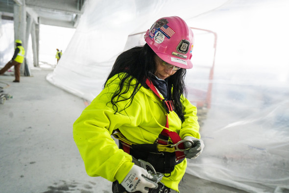 Woman in fall harness