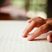 Hands reading braille