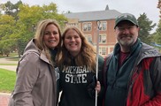 Anna Forest with parents at MSU tailgate 