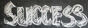 Chalk writing of the word success