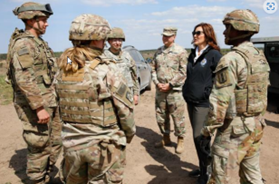Gov. Whitmer with group of armed service members