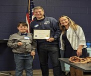 Jack presenting a check to Tyler Benson, Camp Director and Julie Jones- Development Director, Camp Daggett