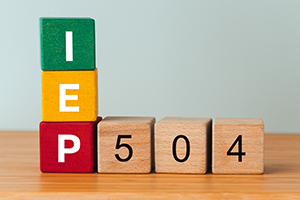 "IEP" and "504" spelled out in individual blocks that create a 90 degree angle