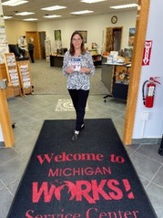 Ammie standing in front of Michigan Works! Service Center mat