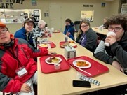 Group picture of Introduction to Culinary Arts students sitting around a table