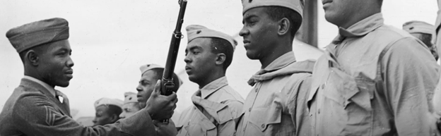 History.com Black History Month banner with Black soldiers saluting 