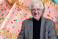 Bill Post wearing a suit with Pop-Tarts as the background