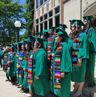 MSU-HEP graduates standing outside