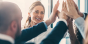 Group of people giving each other a high five